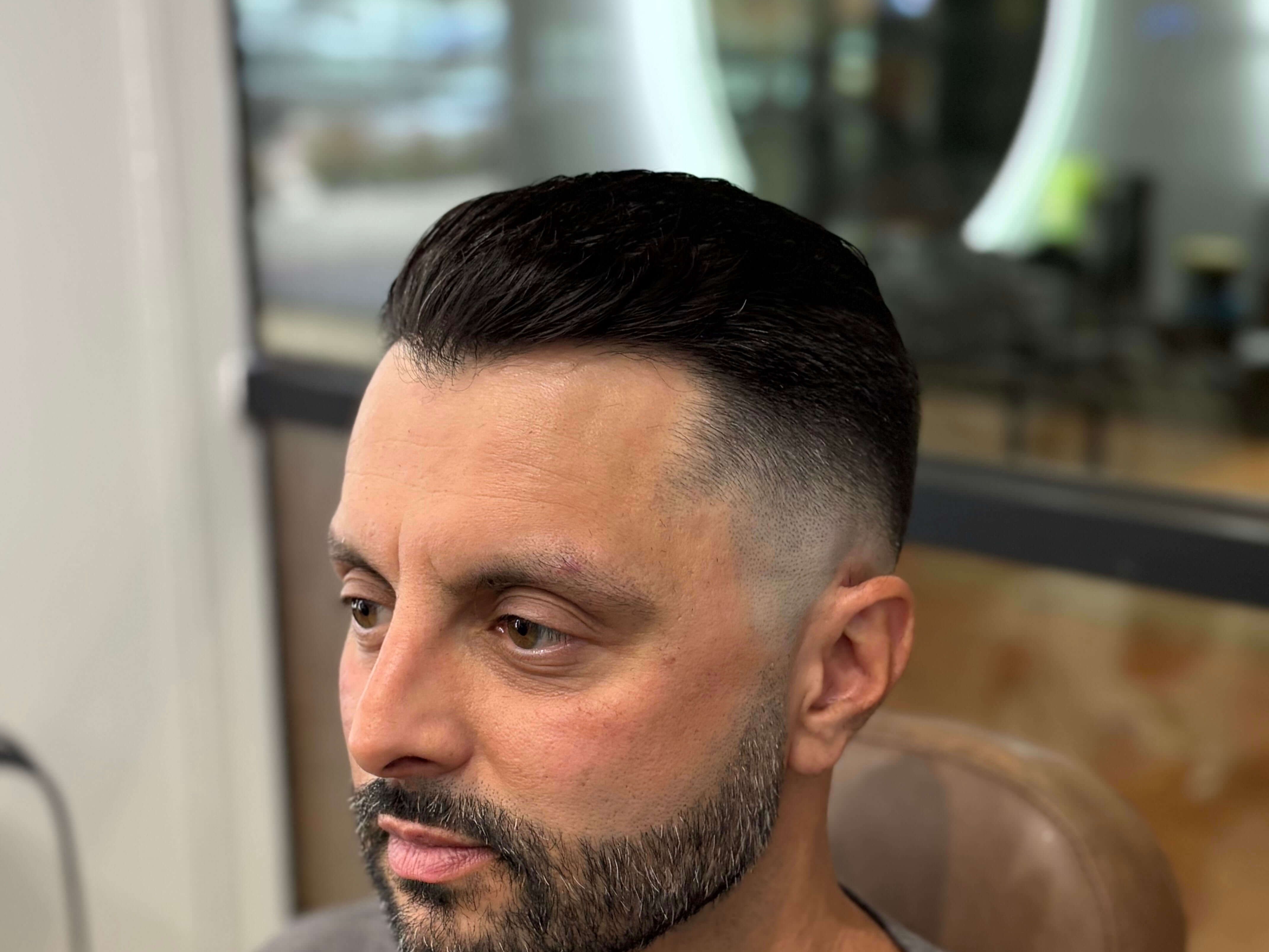 Sharp fade and beard trim, finished look